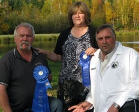 Three people outdoors with ribbons